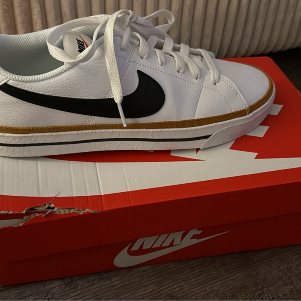 Nike White and Black Sneakers with Gold Trim